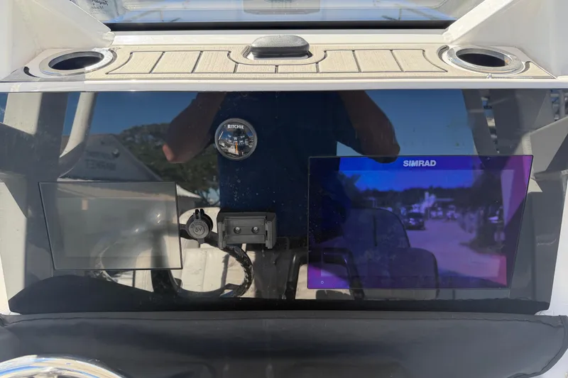 Slide: The Image of Dashboard of 2022 Yamaha Boats 252 FSH Sport with Simrad display and Ritchie compass. - 21