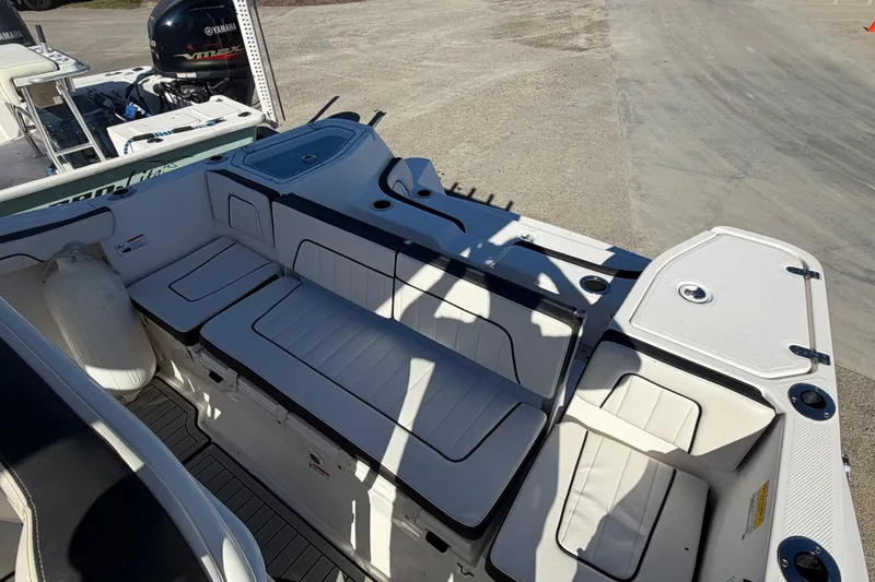 Slide: The Image of 2022 Yamaha Boats 252 FSH Sport interior with seating and storage compartments. - 25