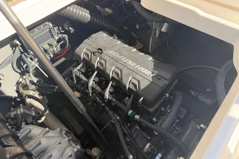Slide: The Image of 2022 Yamaha Boats 252 FSH Sport engine compartment showcasing high output engine components. - 29