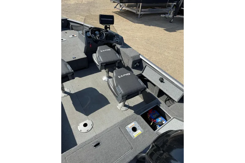 Slide: The Image of 2017 Lund 1775 Impact SS boat interior with seats and control panel. - 10