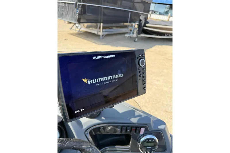 Slide: The Image of Humminbird Helix 9 fish finder on 2017 Lund 1775 Impact SS boat dashboard. - 12