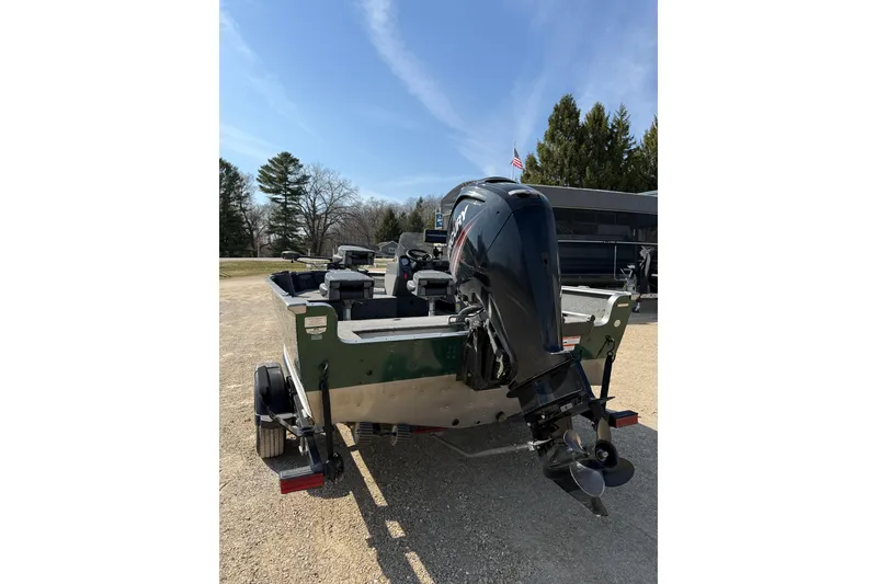 Slide: The Image of 2017 Lund 1775 Impact SS boat with outboard motor on a trailer. - 2