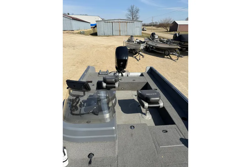 Slide: The Image of 2017 Lund 1775 Impact SS fishing boat with motor, parked outdoors. - 7