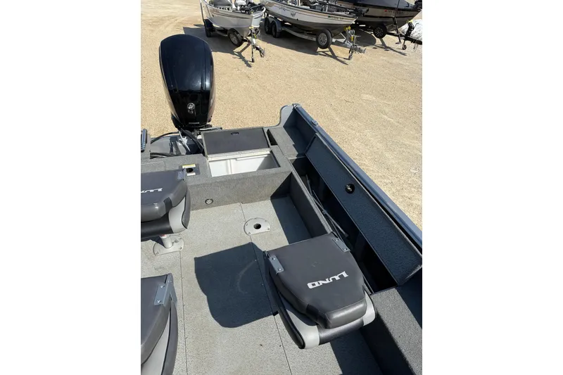 Slide: The Image of 2017 Lund 1775 Impact SS boat interior with seating and storage compartments. - 9