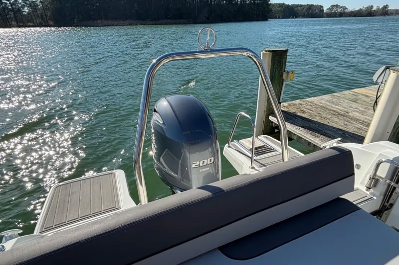 Slide: The Image of 2023 Jeanneau Leader 6.5 CC Series 3 boat with Yamaha 200 engine by a dock. - 9