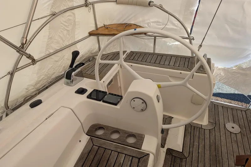 Slide: The Image of Steering wheel and controls of a 2007 Elan Impression 434 sailboat. - 10