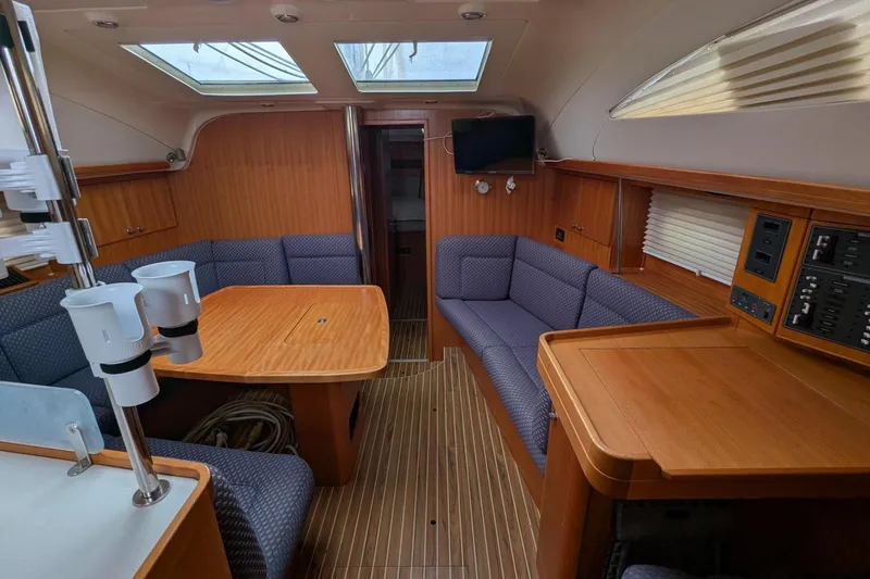 Slide: The Image of Interior of 2007 Elan Impression 434 yacht with wood finish and seating area. - 14