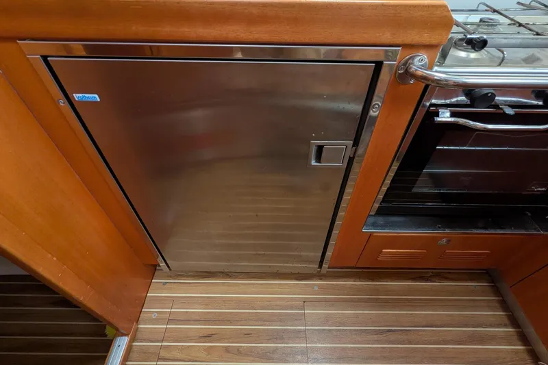 Slide: The Image of Kitchen area of a 2007 Elan Impression 434 yacht with stainless steel appliances. - 21