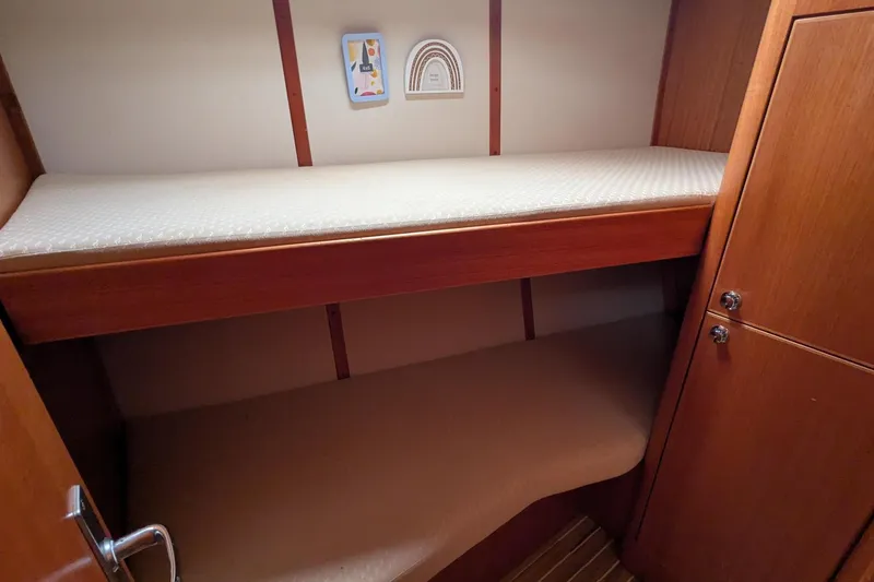 Slide: The Image of Bunk beds in 2007 Elan Impression 434 yacht cabin with wooden interior. - 28
