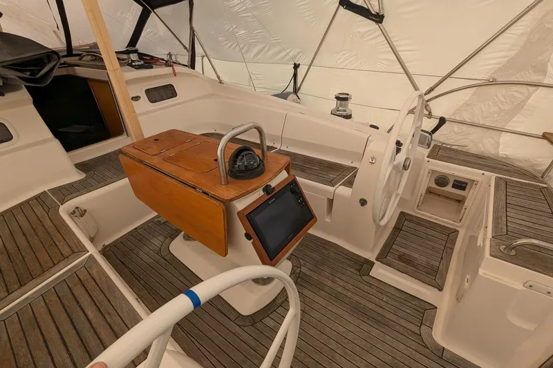 Slide: The Image of 2007 Elan Impression 434 yacht cockpit with wooden accents and navigation equipment. - 3