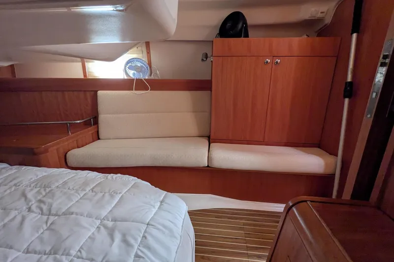 Slide: The Image of Interior of 2007 Elan Impression 434 yacht with wooden cabinetry and cushioned seating. - 30