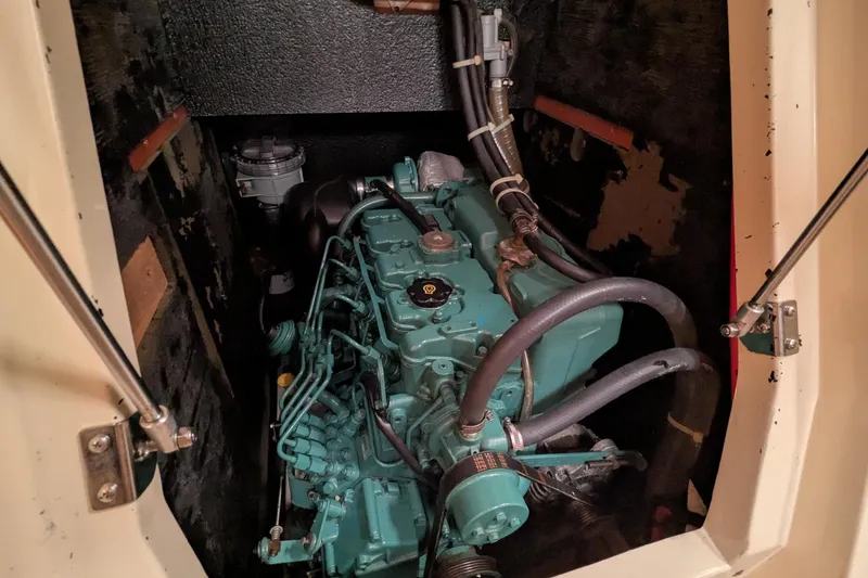 Slide: The Image of Engine compartment of a 2007 Elan Impression 434 sailboat, showcasing mechanical components. - 43