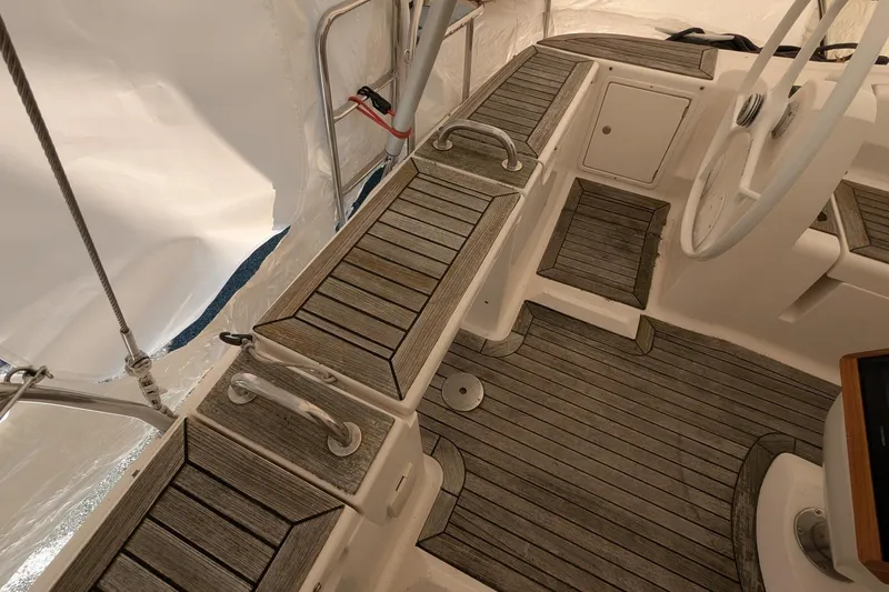 Slide: The Image of Interior of 2007 Elan Impression 434 yacht with wooden flooring and steering wheel. - 7