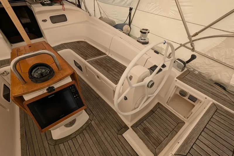 Slide: The Image of 2007 Elan Impression 434 yacht cockpit with steering wheel and navigation equipment. - 8