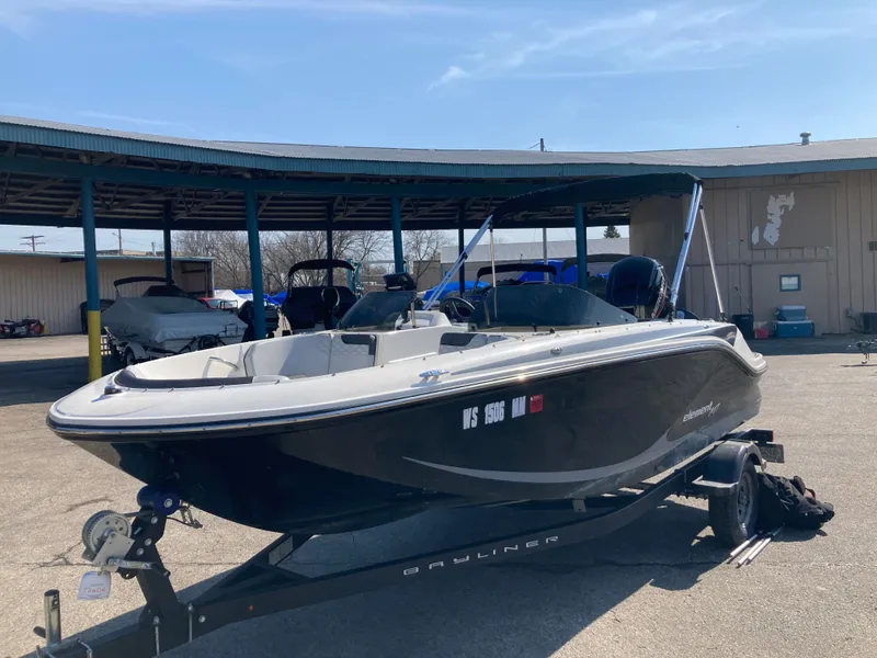 The Image of 2022 Bayliner Element M17 boat on trailer outdoors. - 0