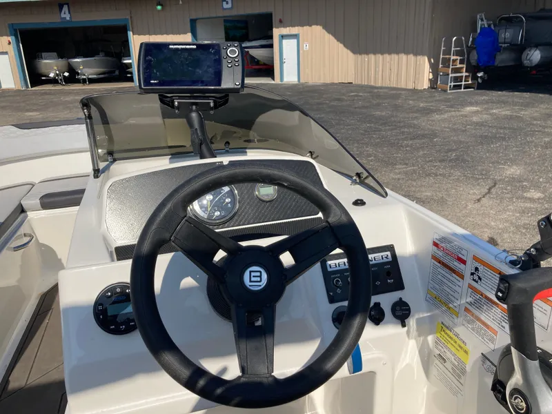 Slide: The Image of Interior view of Bayliner Element M17 helm, year 2022. - 12