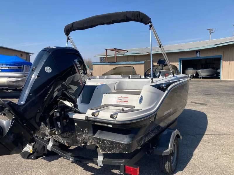 Slide: The Image of 2022 Bayliner Element M17 boat with outboard motor on trailer. - 3