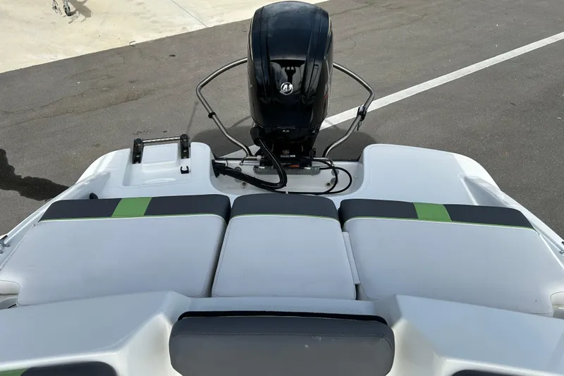 Slide: The Image of 2021 Tahoe T16 boat with outboard motor and cushioned seating. - 11