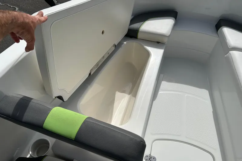 Slide: The Image of Interior storage compartment of a 2021 Tahoe T16 boat with seating and cup holder. - 12
