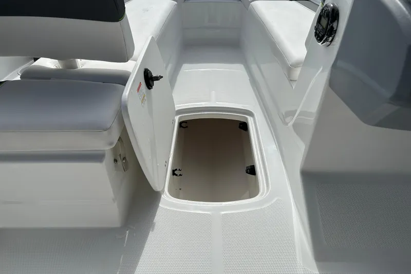 Slide: The Image of Open storage compartment on a 2021 Tahoe T16 boat deck. - 14