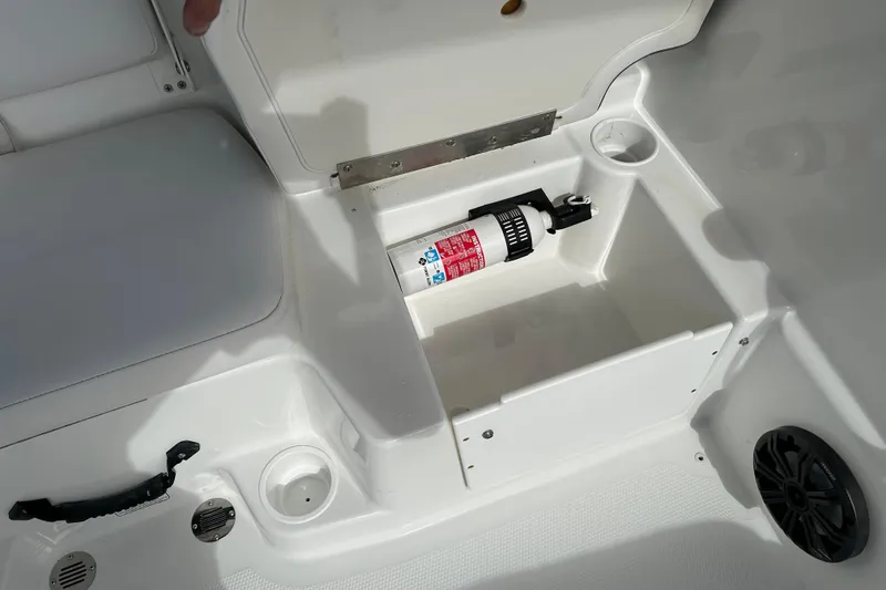 Slide: The Image of Storage compartment in 2021 Tahoe T16 boat with fire extinguisher. - 15