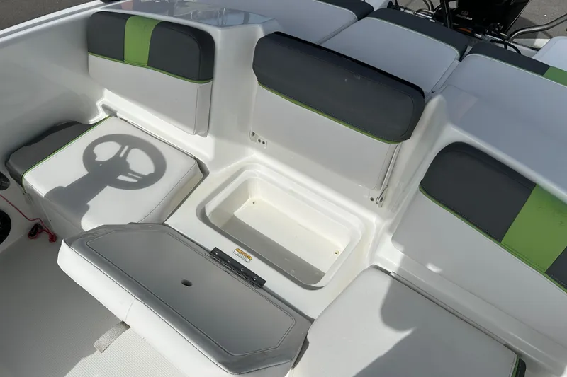 Slide: The Image of 2021 Tahoe T16 boat interior with seating and storage compartments. - 17