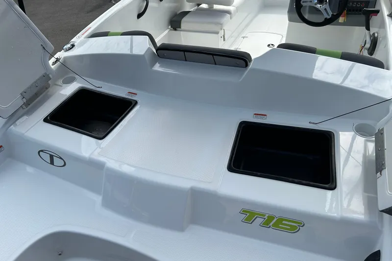 Slide: The Image of 2021 Tahoe T16 boat interior with storage compartments and seating. - 18