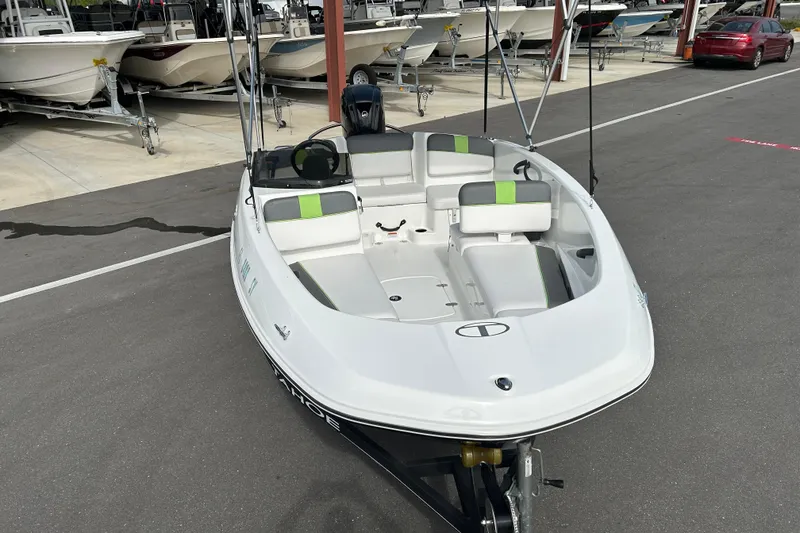 Slide: The Image of 2021 Tahoe T16 boat in a marina, featuring sleek design and modern seating. - 6