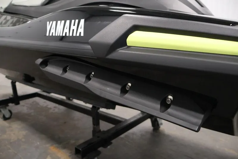 Slide: The Image of 2026 Yamaha WaveRunner VX Cruiser HO, close-up of sleek black and green design. - 25