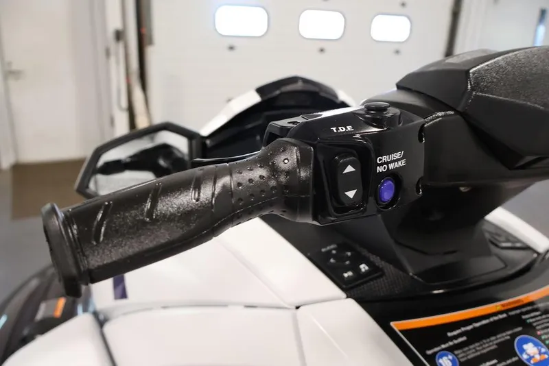 Slide: The Image of 2026 Yamaha WaveRunner VX Cruiser HO handlebar controls in a garage setting. - 16