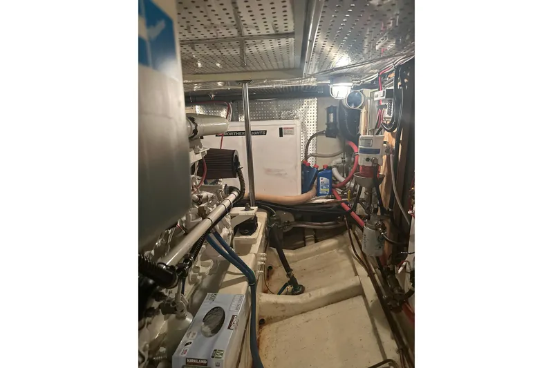 Slide: The Image of Engine room of 2000 Island Gypsy 36 boat, featuring mechanical equipment and wiring. - 18