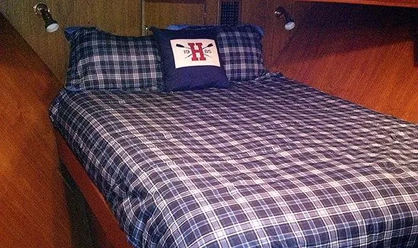 Slide: The Image of Cozy cabin bedroom in 1986 Sea Ranger 47 Pilothouse with plaid bedding. - 11