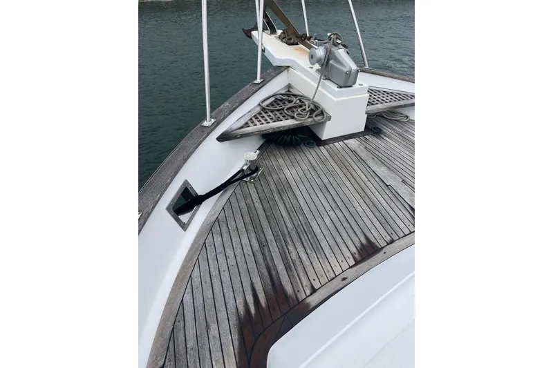 Slide: The Image of Bow of 1986 Sea Ranger 47 Pilothouse with teak decking and anchor equipment. - 22