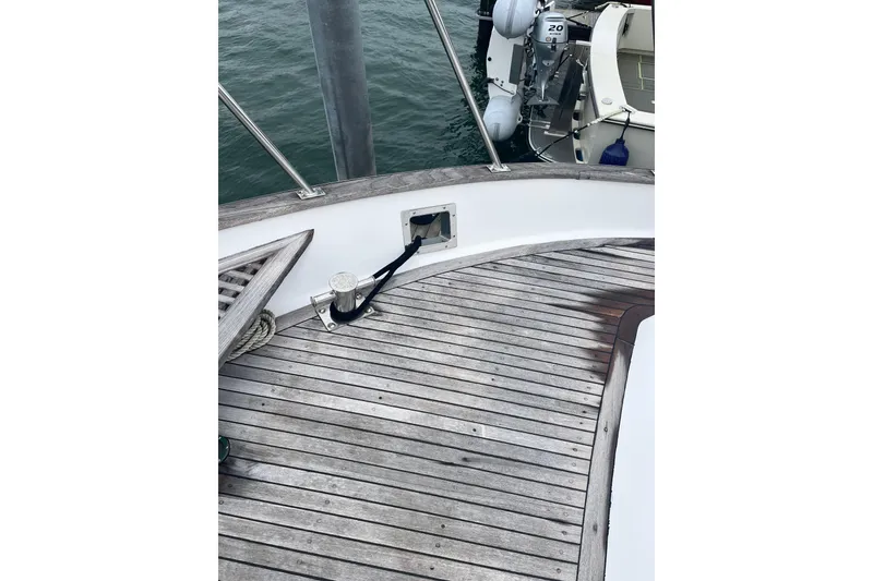 Slide: The Image of 1986 Sea Ranger 47 Pilothouse deck with wooden flooring and mooring equipment. - 26