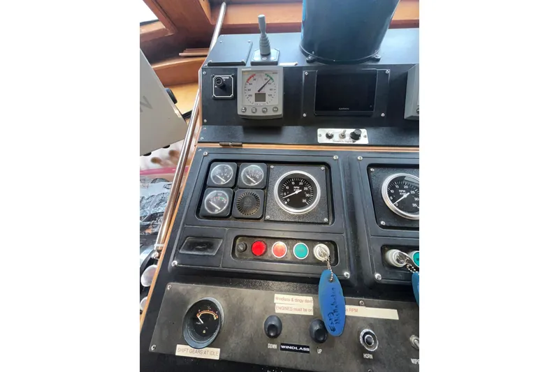 Slide: The Image of Control panel of a 1986 Sea Ranger 47 Pilothouse boat. - 35