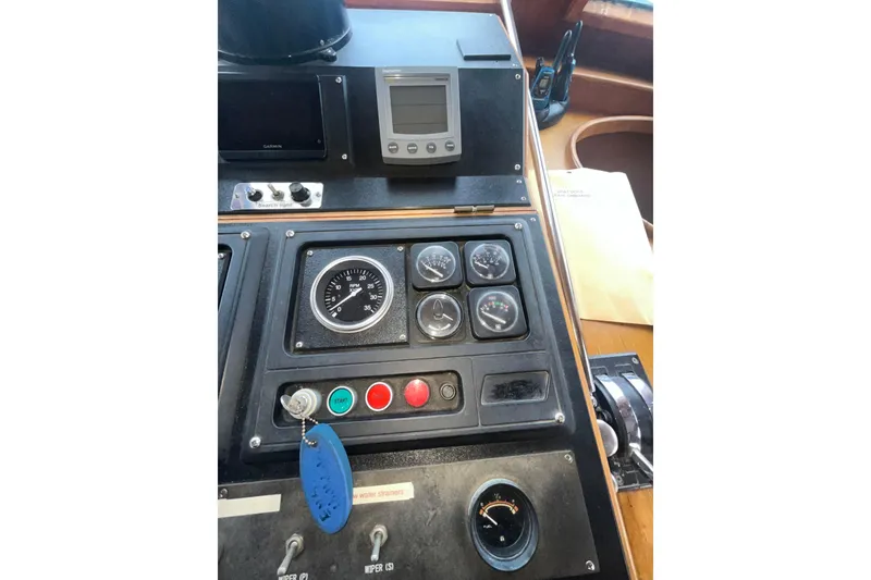 Slide: The Image of Control panel of a 1986 Sea Ranger 47 Pilothouse with gauges and switches. - 36