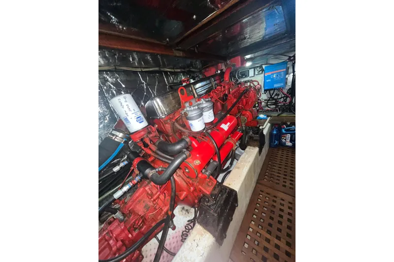Slide: The Image of Engine room of 1986 Sea Ranger 47 Pilothouse with red engine components. - 45