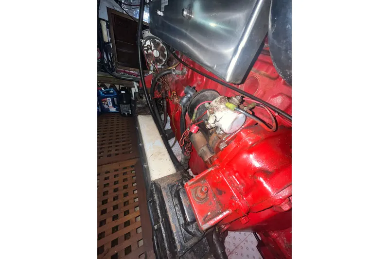 Slide: The Image of Engine compartment of a 1986 Sea Ranger 47 Pilothouse with red components. - 49