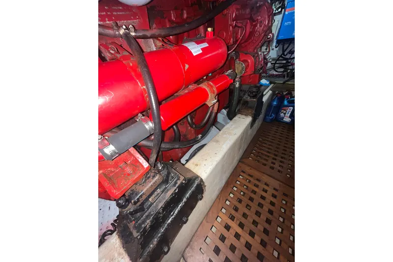 Slide: The Image of Engine room of 1986 Sea Ranger 47 Pilothouse with red machinery components. - 50