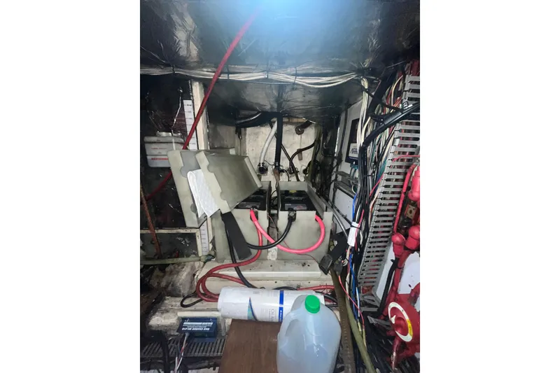 Slide: The Image of Electrical wiring and components inside a 1986 Sea Ranger 47 Pilothouse boat. - 52