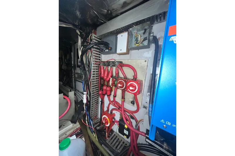 Slide: The Image of Electrical system inside a 1986 Sea Ranger 47 Pilothouse boat, featuring wiring and switches. - 53