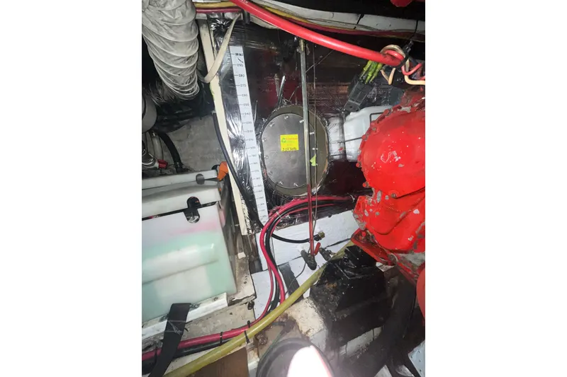 Slide: The Image of Engine room of 1986 Sea Ranger 47 Pilothouse with visible wiring and components. - 58