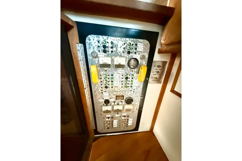 Slide: The Image of Control panel of a 1982 Sea Ray 355T Trawler with gauges and switches. - 21