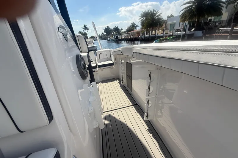 Slide: The Image of 2024 Yamaha Boats 255 FSH Sport H interior with sleek design and spacious deck. - 18