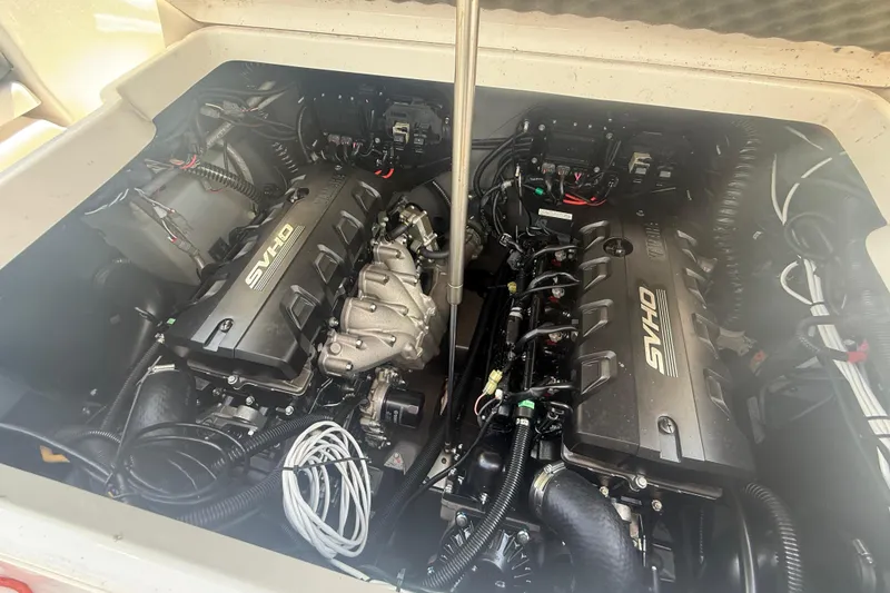 Slide: The Image of 2024 Yamaha Boats 255 FSH Sport H engine compartment with dual SVHO engines. - 25