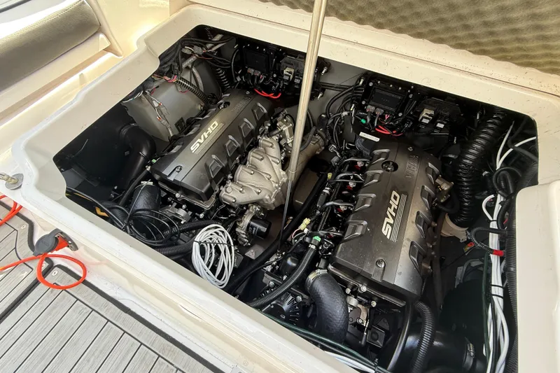 Slide: The Image of 2024 Yamaha Boats 255 FSH Sport H engine compartment with twin SVHO engines. - 29