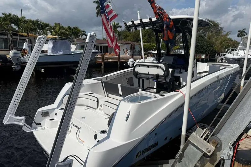 Slide: The Image of 2024 Yamaha Boats 255 FSH Sport H docked, featuring sleek design and modern equipment. - 30