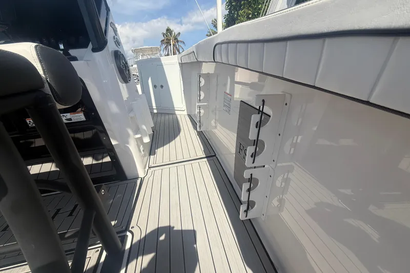 Slide: The Image of 2024 Yamaha Boats 255 FSH Sport H interior with sleek seating and modern design. - 8