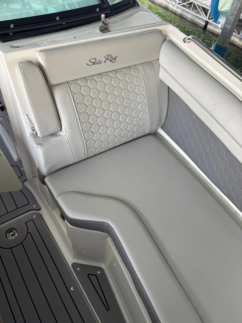Slide: The Image of Interior of a 2020 Sea Ray SDX 270 with cushioned seating. - 11