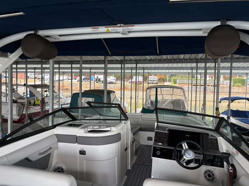 Slide: The Image of Interior view of a 2020 Sea Ray SDX 270 boat in dock. - 14